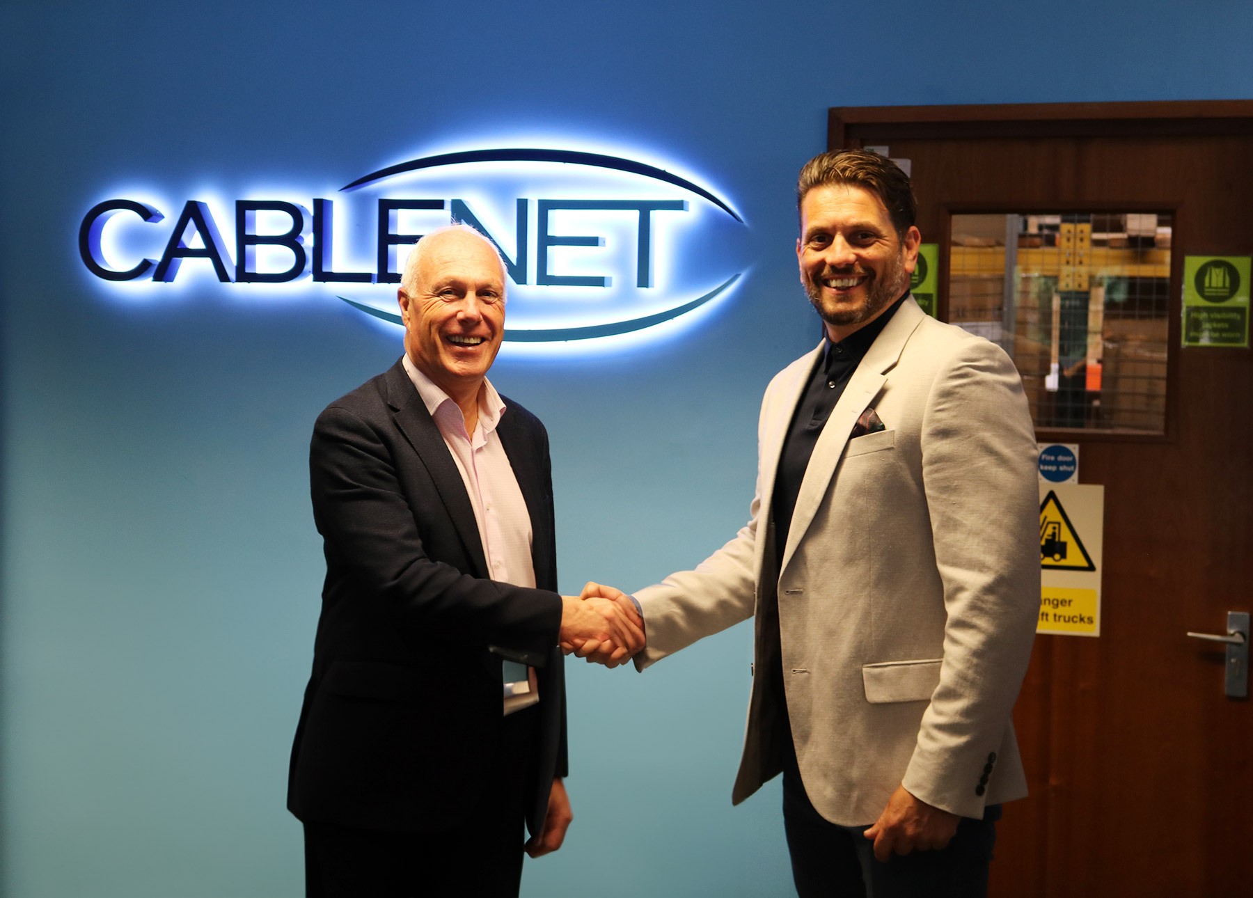 Peter and Huw shaking hands during the Cablenet CMS integration