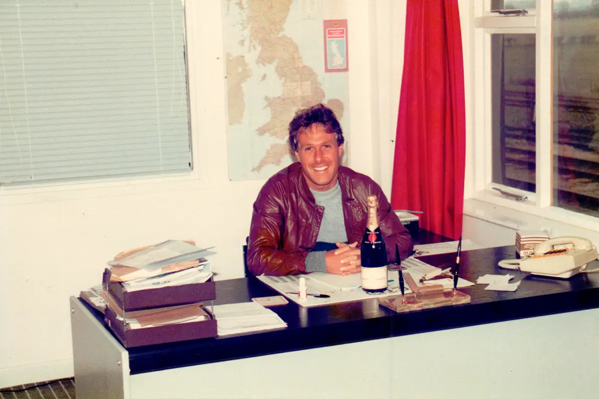 Peter Pearson sat behind the desk of their new premises